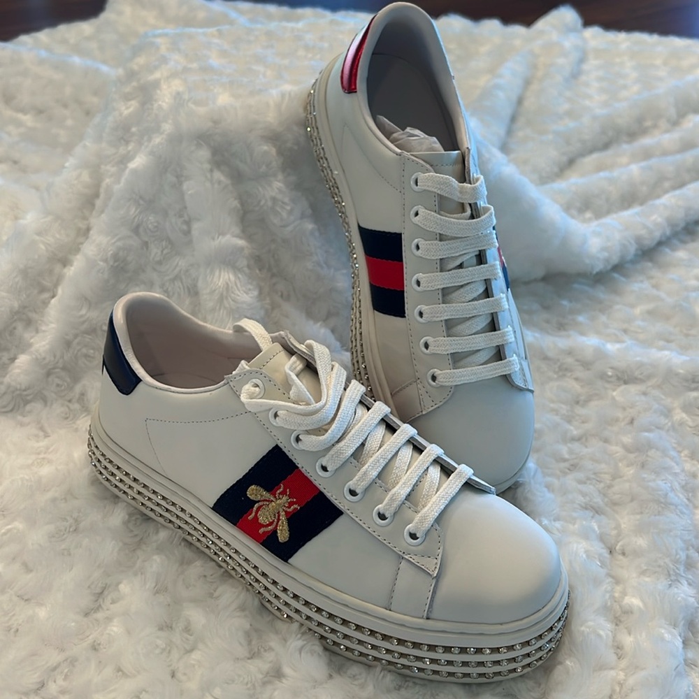 White Designer Sneakers with Red and Blue Accents